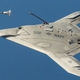 Illustration for article titled Bask In The Awesome Of The Bat-Winged X-47B Sipping Gas From A Tanker